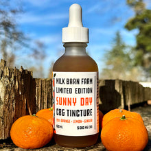 Load image into Gallery viewer, Bottle of Milk Barn Farm CBG Tincture with oranges on a wooden surface